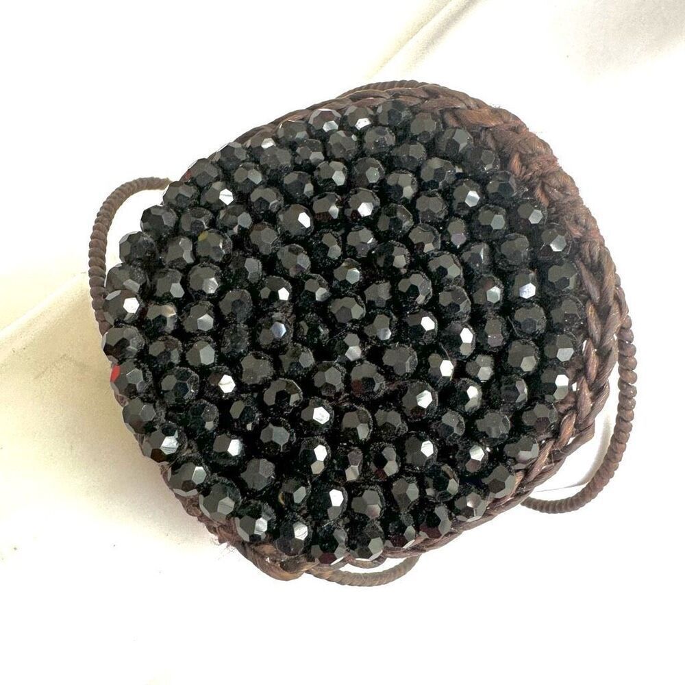 Round  black beaded bracelet on brown cord